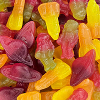 A close-up image of a colorful candy mix, featuring shapes resembling planets and rockets, commonly known as Space Mix gummies. Space mix sweets 100g fruit flavoured jelly sweets space shapes